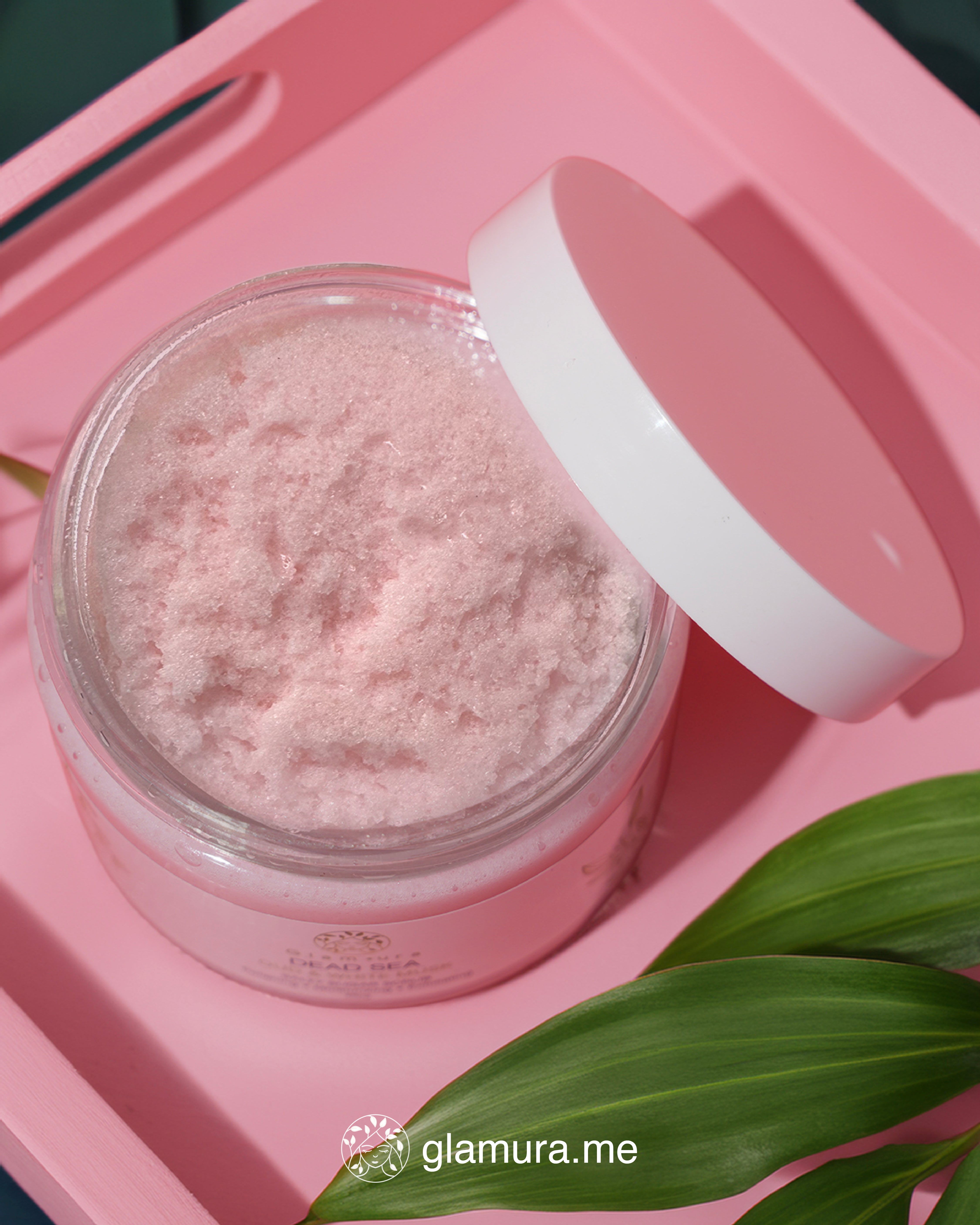 Jar of pink powder with a white lid on a pink tray, featuring the brand 'glamura.me'.